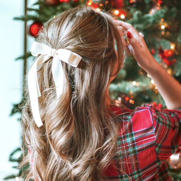 Little girl looking at Christmas tree