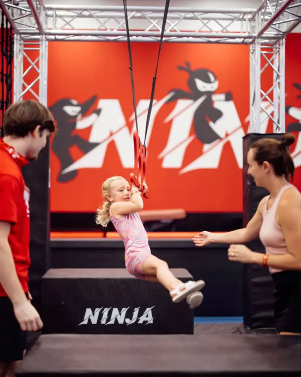 Coaches helping girl