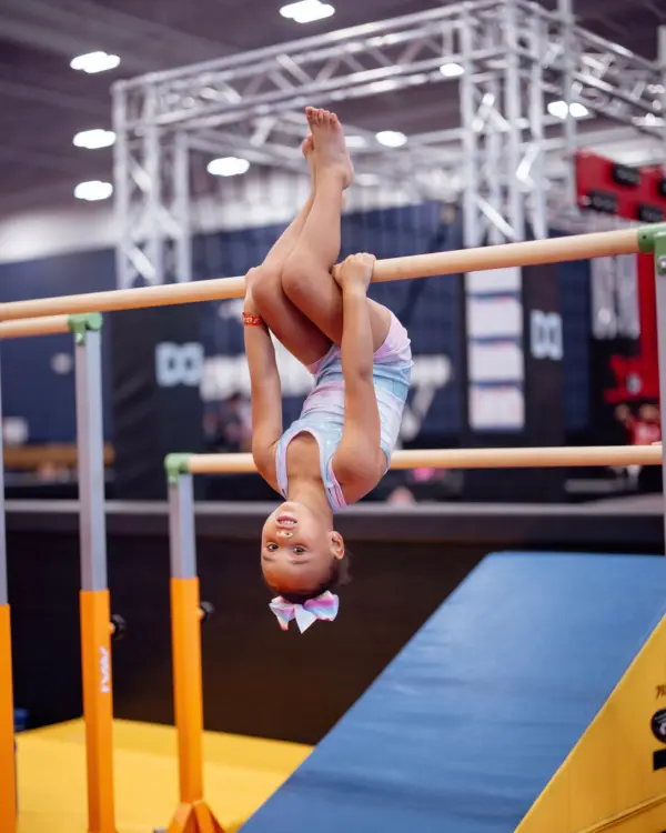 Girl on uneven parallel bars