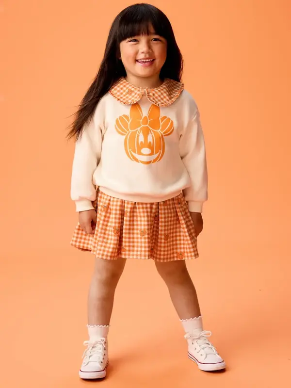 Girl in Minnie Mouse Shirt and skirt